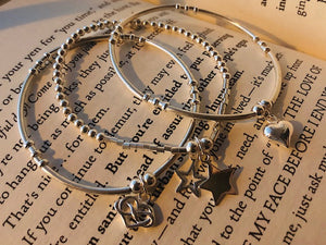 3 bracelet stack, sold heart, open and solid star, heart in hearts charm