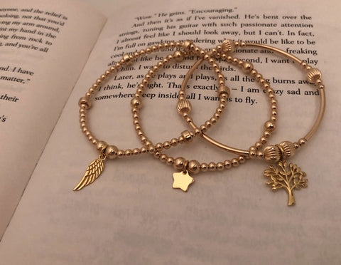 3 bracelet gold stack, feather, star and tree of life